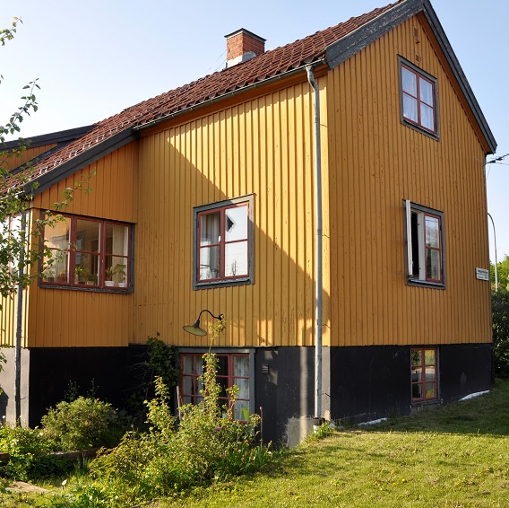 Gul villa med mörk grund